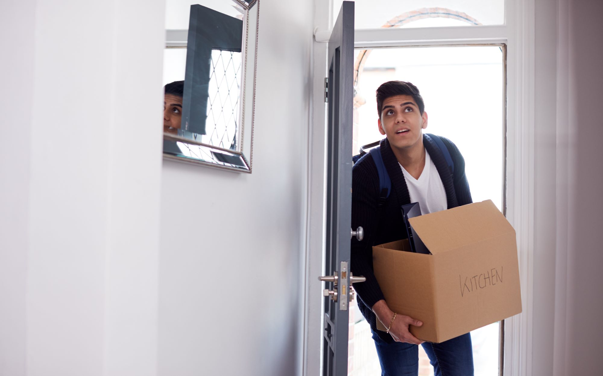 Student with moving in box