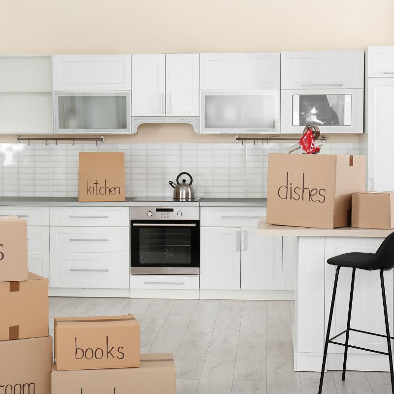 Kitchen with moving boxes while preparing a student rental in Bournemouth for new tenants